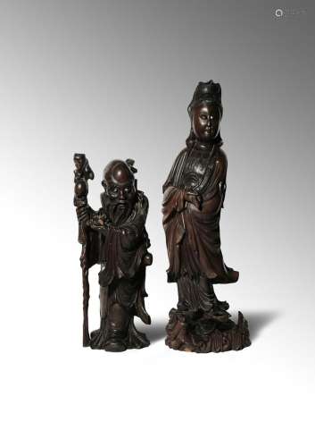 TWO LARGE CHINESE WOOD FIGURES 19TH/20TH CENTURY The larger figure carved as Guanyin standing upon a