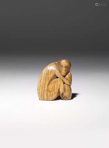 λ A CHINESE IVORY 'MONKEY' TOGGLE MING DYNASTY Carved as a seated monkey arching its back as it
