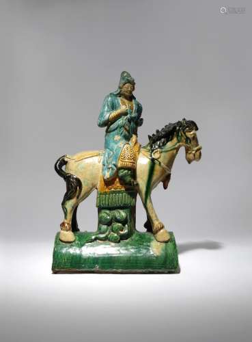 A CHINESE POTTERY ROOF TILE MODELLED AS AN EQUESTRIAN WARRIOR MING DYNASTY The soldier depicted