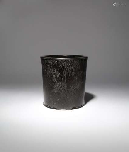 A CHINESE ZITAN 'BAMBOO' BRUSHPOT, BITONG QING DYNASTY Carved to one side with many leafy bamboo