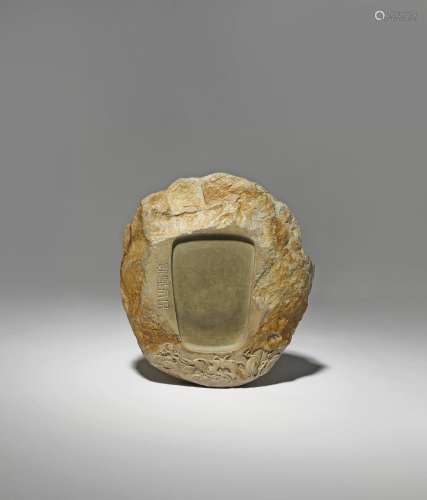 A CHINESE DUAN STONE INKSTONE QING DYNASTY Naturalistically carved as a boulder, with a pine tree at