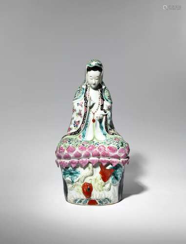 A CHINESE FAMILLE ROSE MODEL OF GUANYIN LATE QING DYNASTY The goddess sits with her legs crossed