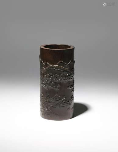 A CHINESE BAMBOO 'LANDSCAPE' BRUSHPOT, BITONG QING DYNASTY The narrow cylindrical body carved in