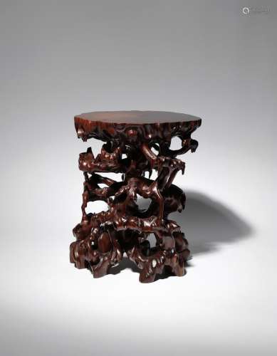 A CHINESE HARDWOOD STAND 20TH CENTURY Naturalistically formed as many twisting gnarled tree