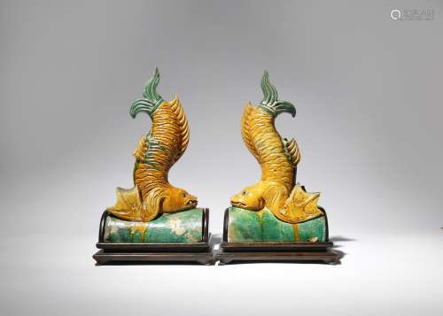 A NEAR PAIR OF CHINESE GREEN AND AMBER GLAZED POTTERY ROOF TILES MING DYNASTY Each modelled as a