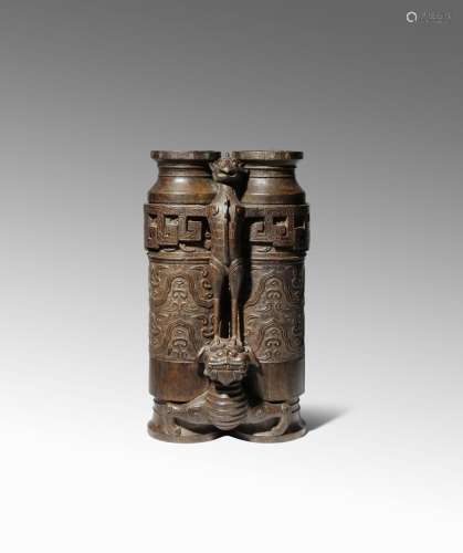 A LARGE CHINESE WOOD CHAMPION VASE QING DYNASTY OR LATER Probably aloeswood, carved as an archaistic