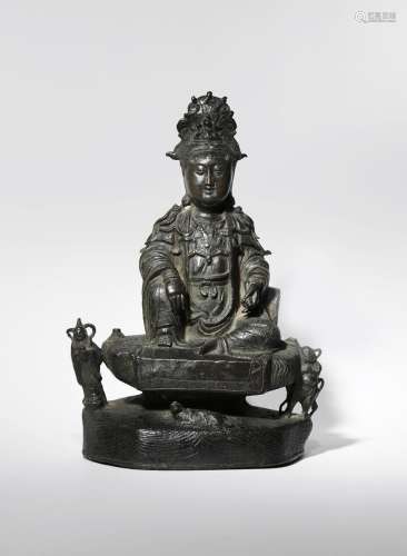 A LARGE CHINESE BRONZE FIGURE OF GUANYIN 17TH CENTURY The deity depicted seated in rajalilasana upon