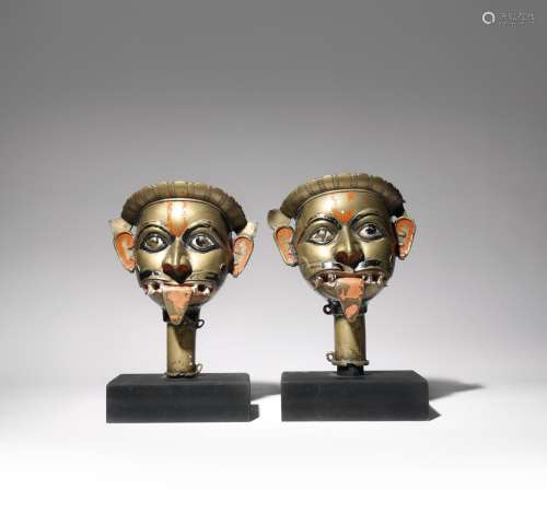 A PAIR OF INDIAN BRASS HEADS OF SHIVA EARLY 19TH CENTURY Each formed as the deity with his mouth