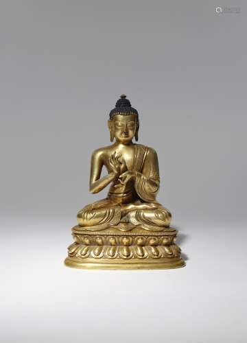 A CHINESE BRONZE FIGURE OF DIPANKARA QING DYNASTY Seated in dhyanasana upon a beaded double lotus