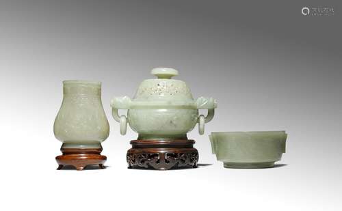 THREE CHINESE PALE CELADON JADE ITEMS QING DYNASTY Comprising: a small vase carved with archaistic