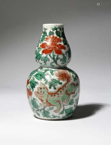 A CHINESE WUCAI GOURD-SHAPED VASE, HULUPING 19TH CENTURY Painted with two lion dogs amidst large