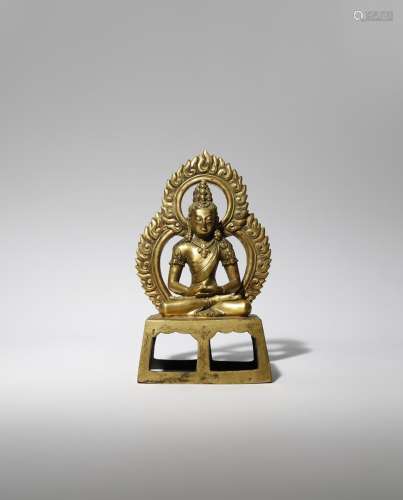 A CHINESE GILT-BRONZE FIGURE OF AMITAYUS QING DYNASTY Depicted seated in dhyanasana upon a