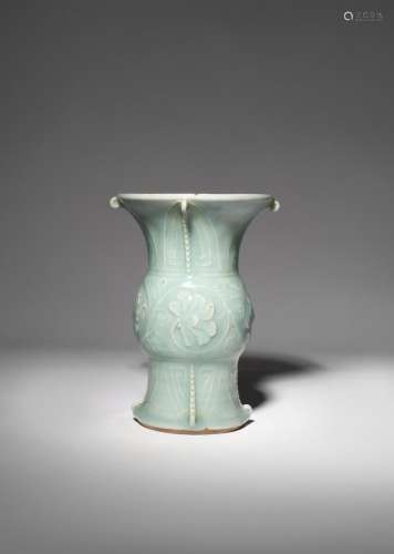 A CHINESE CELADON GU-SHAPED VASE LATE QING DYNASTY The central bulbous section finely carved with