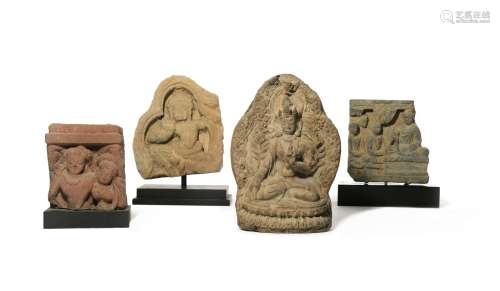 THREE CARVED STONE FRAGMENTARY RELIEFS AND A TERRACOTTA TSA-TSA C.2ND CENTURY AND LATER