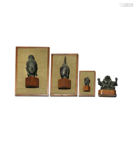 THREE SOUTHEAST ASIAN BRONZE HEADS AND A BRONZE FIGURE OF GANESHA 20TH CENTURY Each of the heads