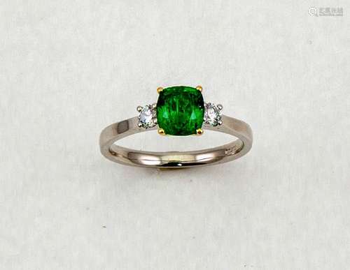 An 18ct white gold, emerald and diamond ring, the emerald approximately 1.30ct, the two flanking