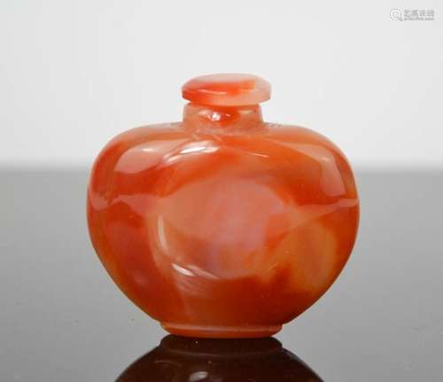 A Chinese red agate handcarved snuff bottle