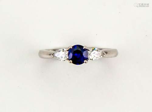 An 18ct white gold and sapphire ring, the brilliant cut sapphire, 0.50cts, with pear shape diamond