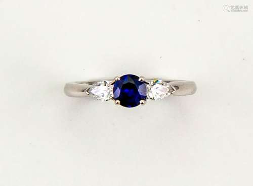 An 18ct white gold and sapphire ring, the brilliant cut sapphire, 0.50cts, with pear shape diamond