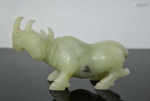 A Chinese handcarved natural heitian green ice jade statue of rhinoceros 12cm length x 7cm high