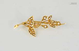 A gold (unmarked) and seed pearl brooch, in the form of a leafy spray, 4.3g.