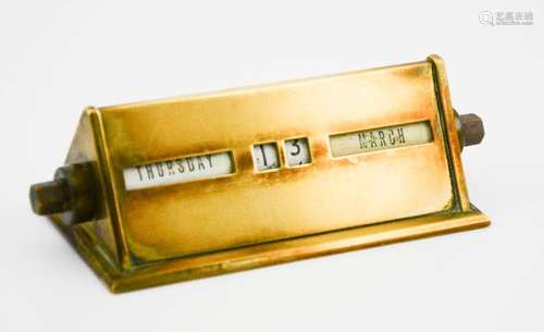 A vintage brass desk calendar, 13cm high.