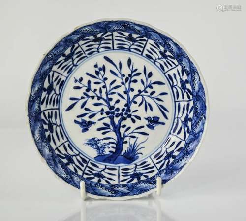 An early 19th century blue and white Japanese dish, with signature to the base, depicting birds