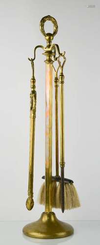 A brass fireside companion set.