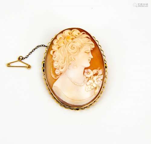 A 9ct gold cameo brooch, carved with a female profile portrait, the gold setting having a safety