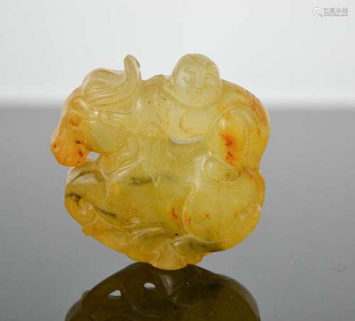 A Chinese natural heitian jade hand carved pendant of man riding horse. 5cm high by 5cm wide