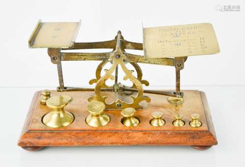 A set of Victorian oak and brass Postal letter scales, with the original weights, the oak base