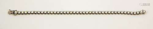 An 18ct white gold tennis bracelet, the brilliant cut diamonds totalling 5.19ct, 13.8g.