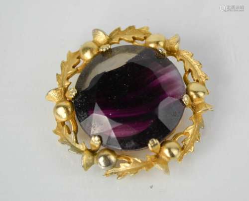 A vintage Scottish gilt thistle brooch with amethyst agate glass inset, indistinctly signed