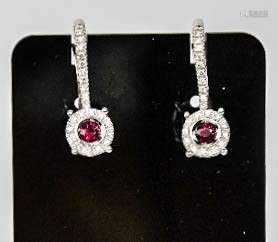 A pair of 18ct white gold ruby and diamond drop cluster earrings, the ruby approx 0.30cts, the