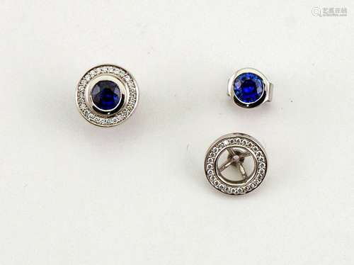 A pair of 9ct white gold, sapphire and diamond halo earrings.