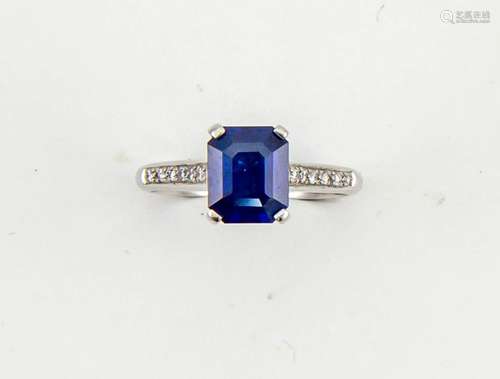 A platinum, sapphire and diamond ring, the emerald cut sapphire approx 1ct, with diamonds set to the