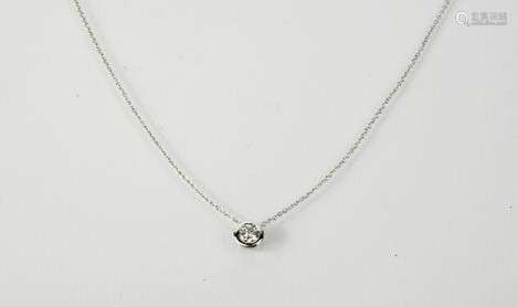 An 18ct white gold and rub over setting, slider pendant on chain, the diamond approx 0.5ct, 2g.