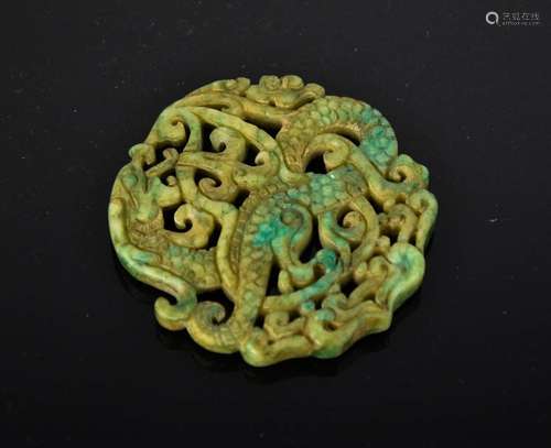 A Chinese natural green jade hand carved pierce-work dragon pendant. 6.5cm by 6.5cm