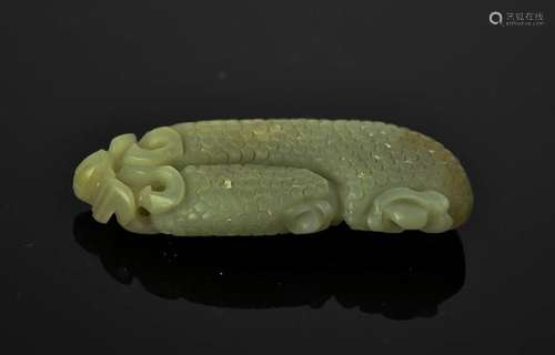 A Chinese natural heitian green jade hand carved pendant. 6cm by 6.5cm