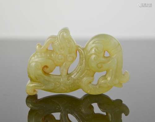 A Chinese natural heitian jade hand carved dragon. 6cm by 4cm