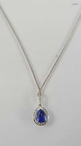 An 18ct white gold, blue sapphire and diamond pendant, the pear cut sapphire approximately 1.06ct,