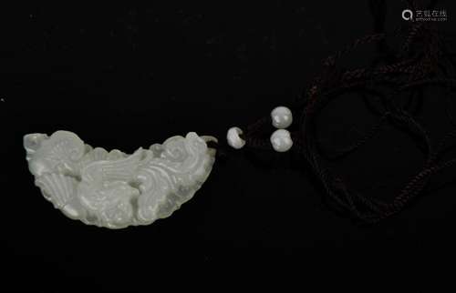 A Chinese natural white jade half-moon carved floral pendant with cord and jade beads