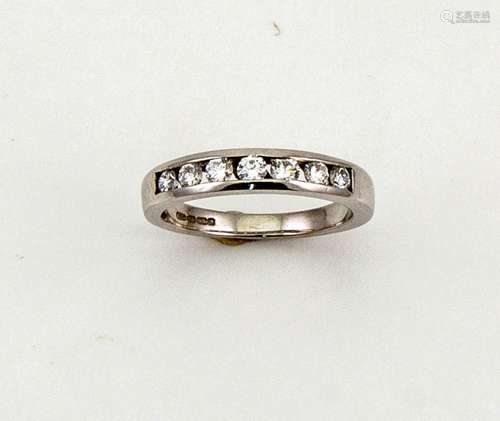 An 18ct white gold and diamond eternity ring, set with seven brilliant cut diamonds totalling 0.