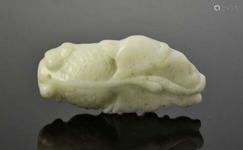 A Chinese natural white jade hand carved fish pendant. 5.5cm by 2.5cm