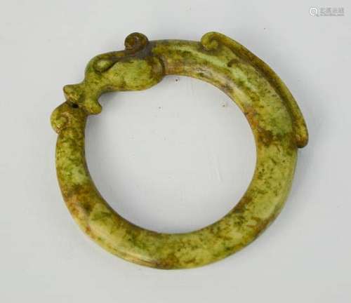 A Chinese green jade handcarved dragon bangle. 8cm