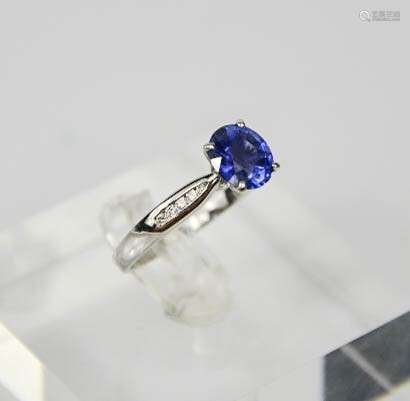 An 18ct white gold, sapphire and diamond ring, the sapphire approx 1.5ct, diamonds set to the