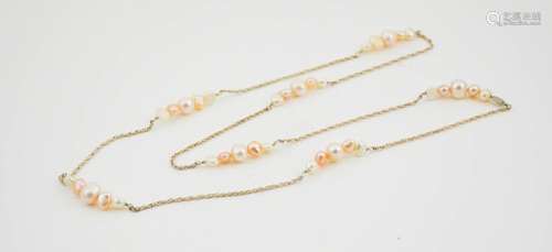 A silver and natural pearl necklace, 60cm long.