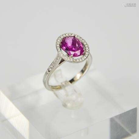 An 18ct white gold, pink sapphire and diamond ring, the sapphire approx 2.7cts surrounded by 0.