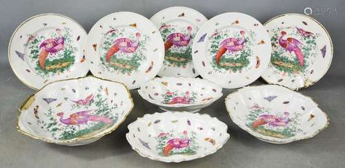 A group of 19th century Chelsea plates, dishes and bowls, depicting peacocks, butterflies and