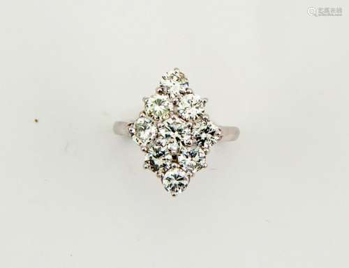 An 18ct white gold (tested, unhallmarked) diamond ring, the nine brilliant cut diamonds total